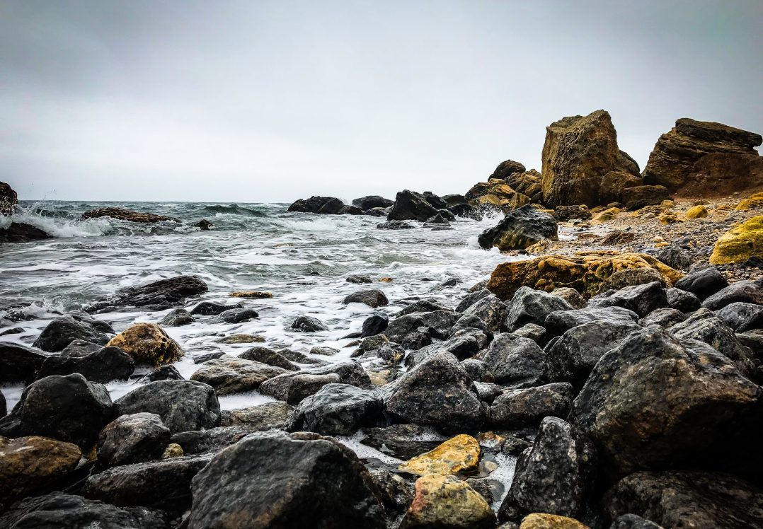 Empty autumn beaches covered by waves