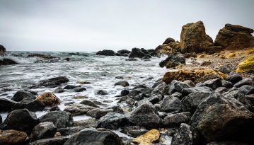 Empty autumn beaches covered by waves